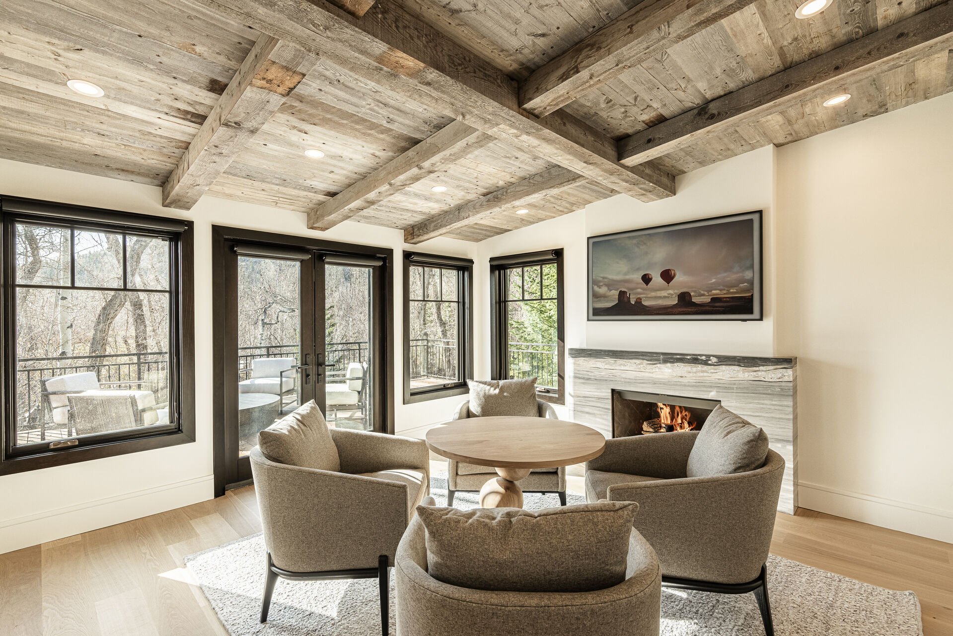 Sun Peak Manor House - Sitting room with gas fireplace, smart TV and deck access Sun Peak Manor House - Sitting room with gas fireplace, smart TV and deck access