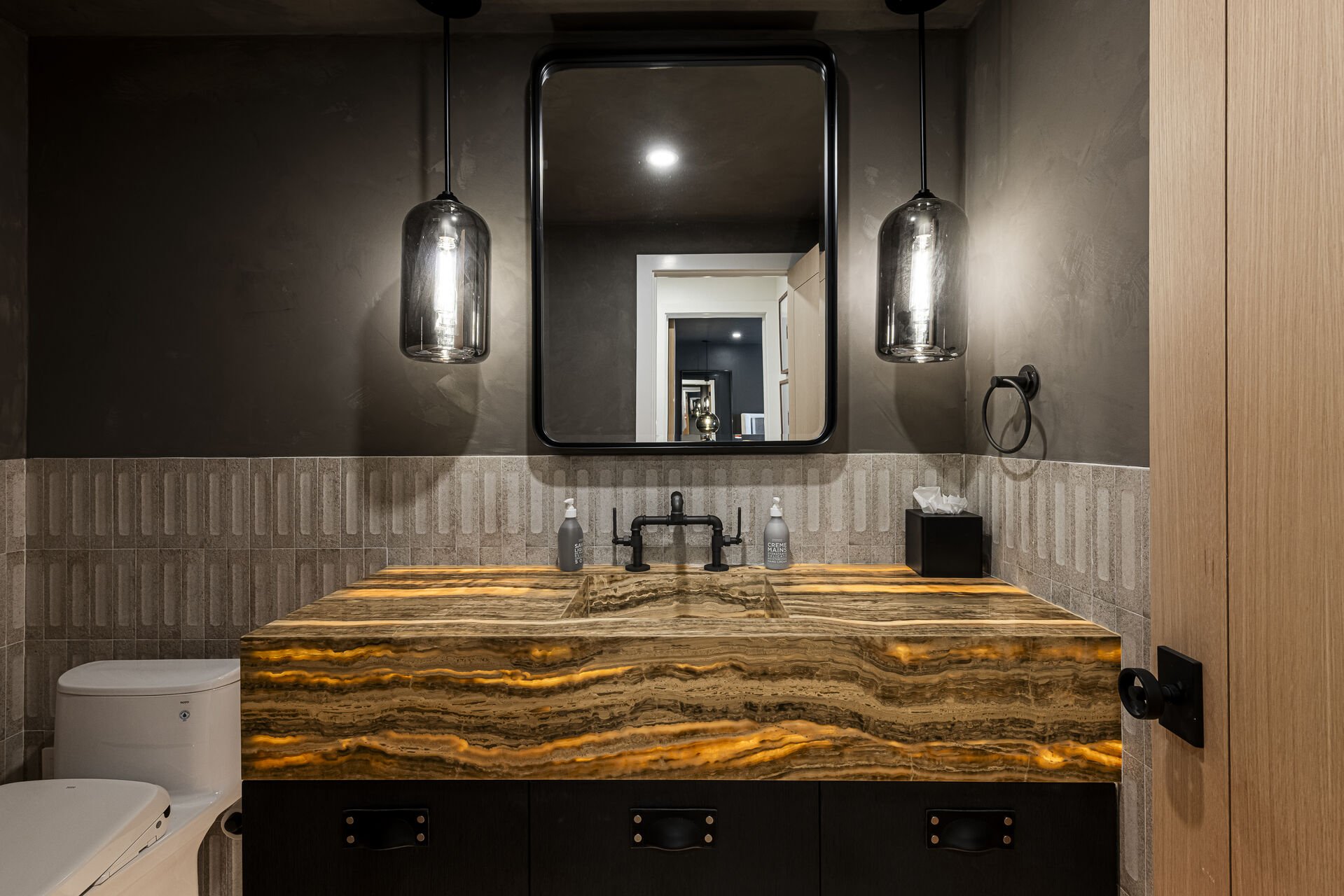 Sun Peak Manor House - Powder room where the light shines through the stone counter Sun Peak Manor House - Powder room where the light shines through the stone counter