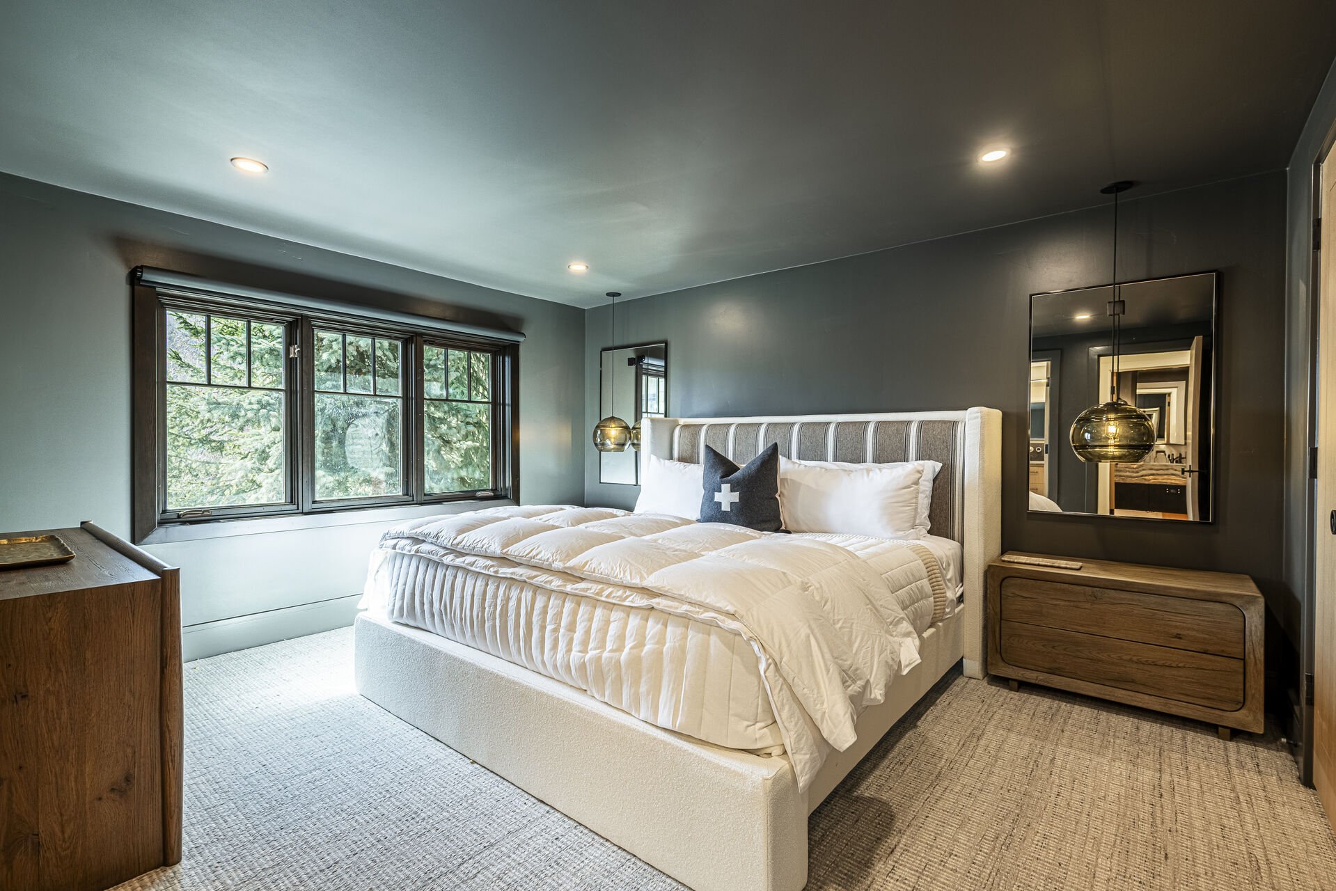 Sun Peak Manor House - Main Level Guest Bedroom 3 with a plush king bed Sun Peak Manor House - Main Level Guest Bedroom 3 with a plush king bed