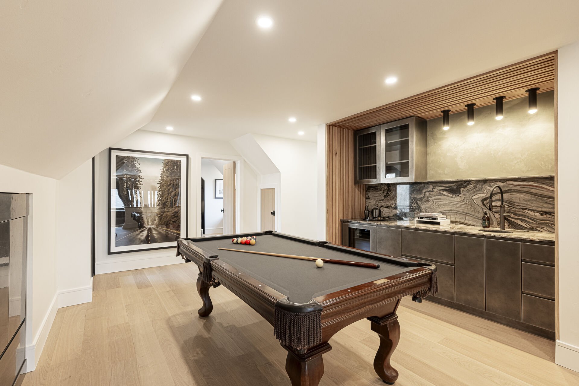 Sun Peak Manor House - Game room with a wet bar with mini fridge and pool table Sun Peak Manor House - Game room with a wet bar with mini fridge and pool table